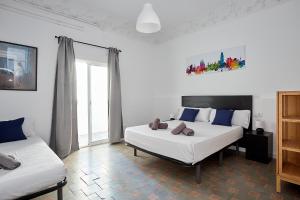 Postel nebo postele na pokoji v ubytování Key Barcelona HOUSING (Carrer Girona)
