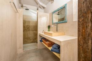 a bathroom with a sink and a shower at Villa Dassos by Villa Plus in Skinária +11 photos