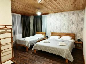 Postel nebo postele na pokoji v ubytování Lastili Inn Hotel