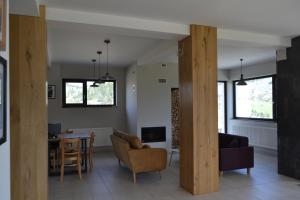 a living room with a table and chairs at Panorama in Fundata