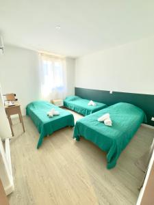 Giường trong phòng chung tại Auberge U Pampasgiolu
