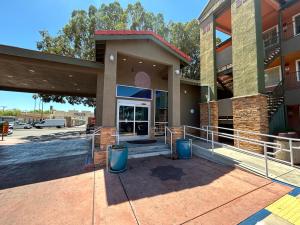 a lobby of a building with a glass door at Motel 6 Pasadena, CA Old Town Pasadena Area in Pasadena