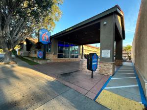 a gas station with a pay phone in front of it at Motel 6 Pasadena, CA Old Town Pasadena Area in Pasadena