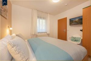 Postel nebo postele na pokoji v ubytování Nur 100 m zum Strand FeWo Meerweh