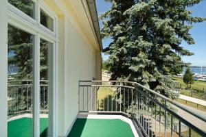Balkón nebo terasa v ubytování Ferienwohnung Strandglück am Malchower See mit Garten
