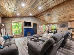 a living room with a couch and a fireplace at Floatin Daze in Wright City
