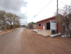 a house on the side of a dirt road at Casa Tomas 2 in Villa Unión