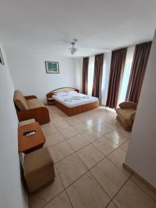 Ένα ή περισσότερα κρεβάτια σε δωμάτιο στο Vila OK2