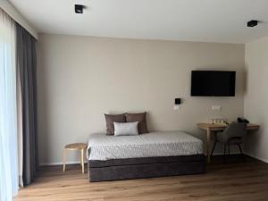 Postel nebo postele na pokoji v ubytování Hotel Pontives
