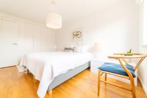 Ένα ή περισσότερα κρεβάτια σε δωμάτιο στο Apartment Aroeira Golf I