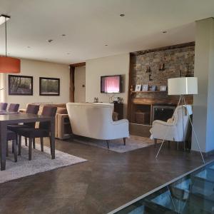 a living room with a couch and a table at Moinho da Ponte Velha in Bragança