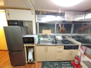 Η κουζίνα ή μικρή κουζίνα στο Garden House +15 φωτογραφίες