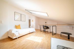 a bedroom with a bed and a desk at Apartment Aroeira Golf II in Carcereiro