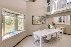 a dining room with a white table and chairs at Spacious Home with Game Room, 2 Mi to Concord Mills! in Concord