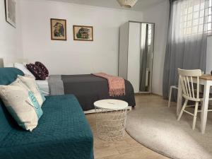 a living room with a couch and a table at Studio Apartments Siesta in Sarajevo