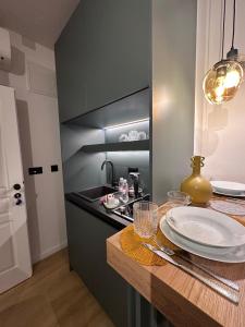 Η κουζίνα ή μικρή κουζίνα στο Four Elements Apartments