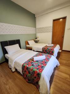 Postel nebo postele na pokoji v ubytování Treeline Urban Inn
