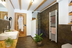 a bathroom with a sink and a shower at Heimatglück in Lautenbach +32 photos