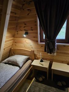 Ένα ή περισσότερα κρεβάτια σε δωμάτιο στο Mali raj Žabljak