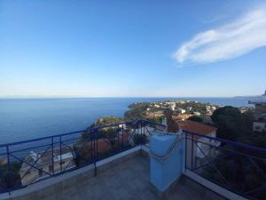 a balcony with a view of the ocean at The Big Blue in Gythio