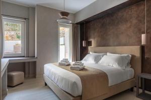 a bedroom with a large bed and a window at Pool & Spa Deluxe in Rome +26 photos