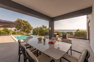 The swimming pool at or close to Seaview Villa A`More with heated pool