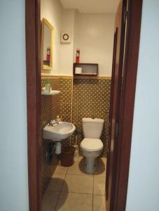 a bathroom with a toilet and a sink at Marina Puerto Luxurious apartment in Tetouan +7 photos
