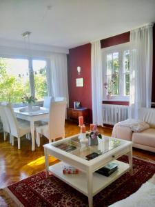 a living room with a table and a dining room at Ferienwohnung Panoramablick Freudenstadt in Freudenstadt