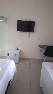 Postel nebo postele na pokoji v ubytování Pousada Casa Apoena