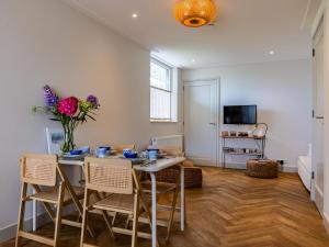 TV a/nebo společenská místnost v ubytování Studio Haas