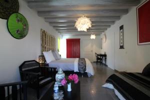a bedroom with a bed and a table with flowers at Harrieta in Masparraute +25 photos