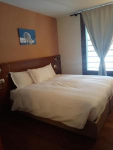 Postel nebo postele na pokoji v ubytování Residence Orma