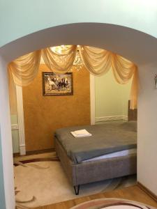 Postel nebo postele na pokoji v ubytování Петрос Family Hotel
