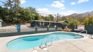 a small swimming pool with a fence around it at The Tokopah Sequoia Motel RM 1 in Three Rivers