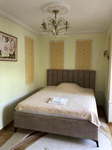 Postel nebo postele na pokoji v ubytování Петрос Family Hotel