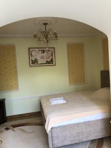 Postel nebo postele na pokoji v ubytování Петрос Family Hotel