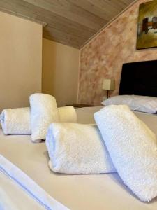 a bedroom with two white pillows on a bed at Diamond Maisonette in Kavála