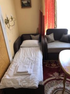 Postel nebo postele na pokoji v ubytování Петрос Family Hotel