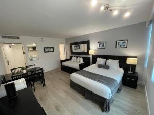 Ένα ή περισσότερα κρεβάτια σε δωμάτιο στο Shine Suites Studio 8