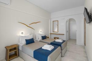 Postel nebo postele na pokoji v ubytování Pandrossos Hotel