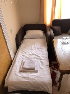 Postel nebo postele na pokoji v ubytování Петрос Family Hotel