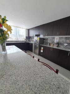 Η κουζίνα ή μικρή κουζίνα στο Nayon Residence Fasmin