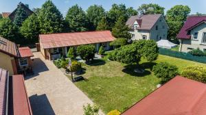 an aerial view of a house with a yard at Malinowka in Jantar