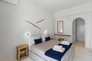 Postel nebo postele na pokoji v ubytování Pandrossos Hotel