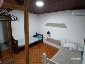 Ένα ή περισσότερα κρεβάτια σε δωμάτιο στο Amazonia Casa Hostal