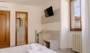 Postel nebo postele na pokoji v ubytování Hotel Miralago