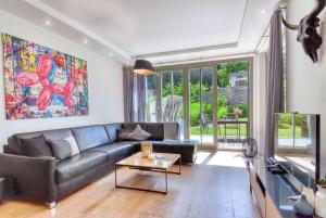 โทรทัศน์และ/หรือระบบความบันเทิงของ Ferienwohnung Baltic Lounge in der Villa Amalie Binz
