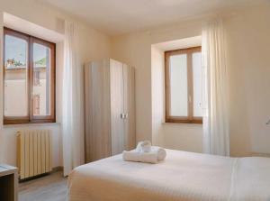 Postel nebo postele na pokoji v ubytování Hotel Miralago