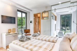 Et tv og/eller underholdning på Ferienwohnung Spa Penthouse in der Villa Amalie Binz