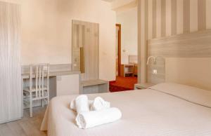 Postel nebo postele na pokoji v ubytování Hotel Miralago